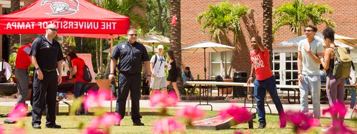 People playing Cornhole 